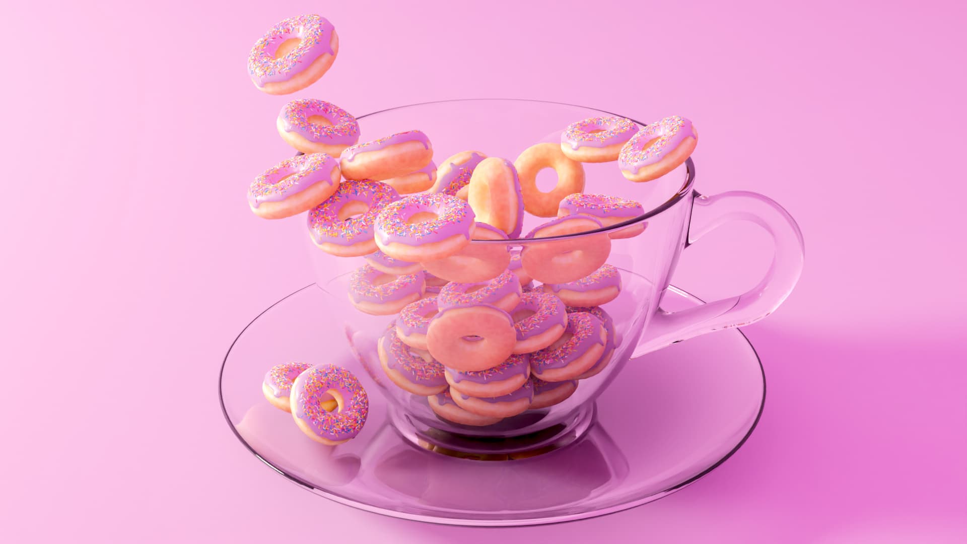 An image of a cup of glass with a lot of little donuts falling inside it.